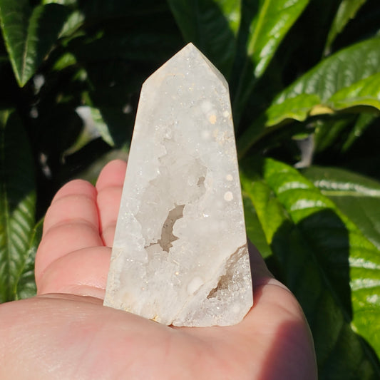 Sparkling druzy filled White Agate Geode Obelisk. White glittery crystal with quartz portal.