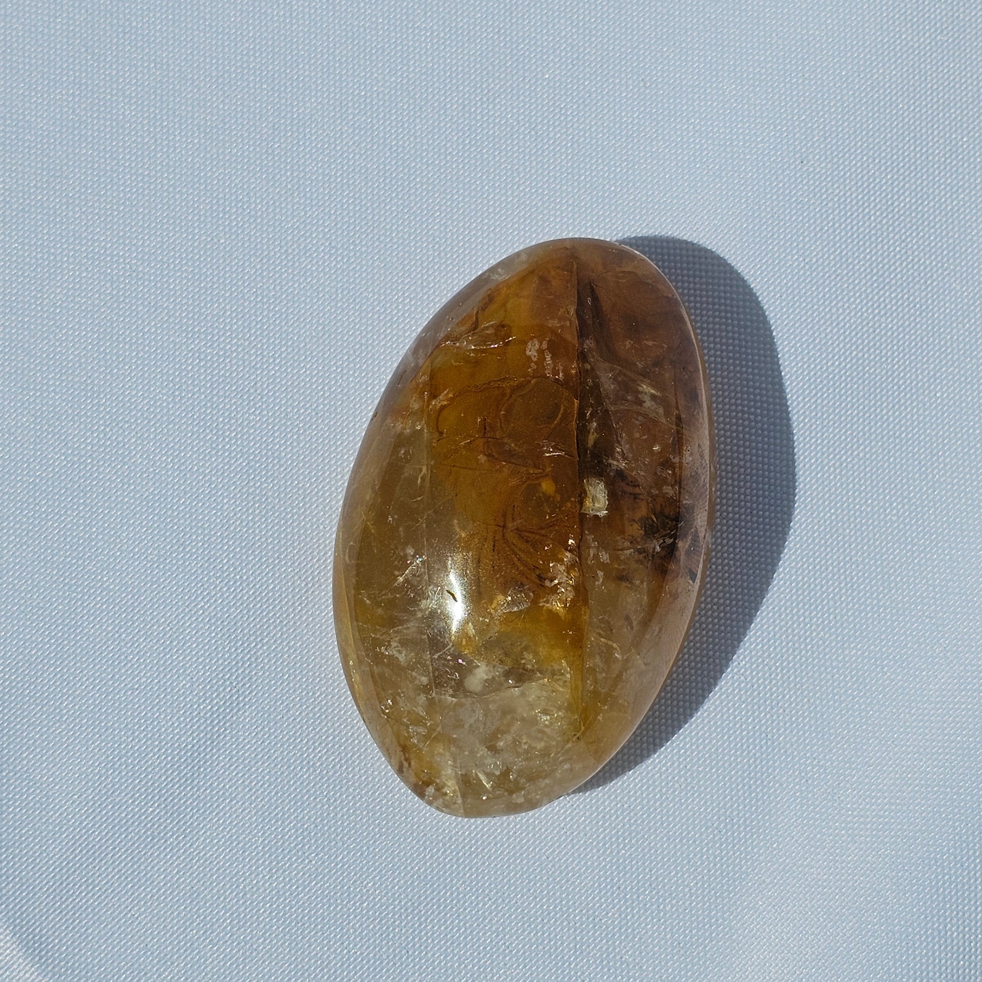 Stunning translucent Golden Healer palm stone with beautiful Dendritic inclusions.
