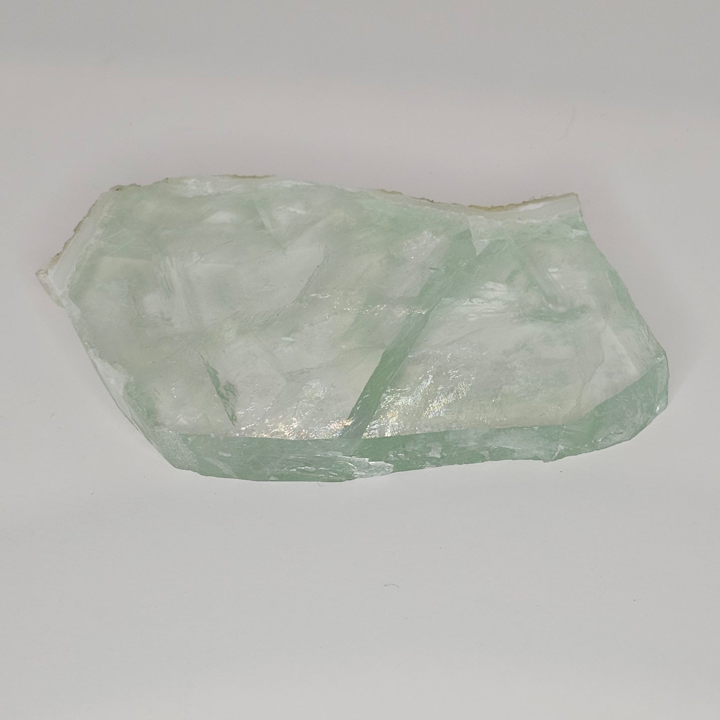 Stunning transparent Green Fluorite slab overflowing with gorgeous rainbows within.