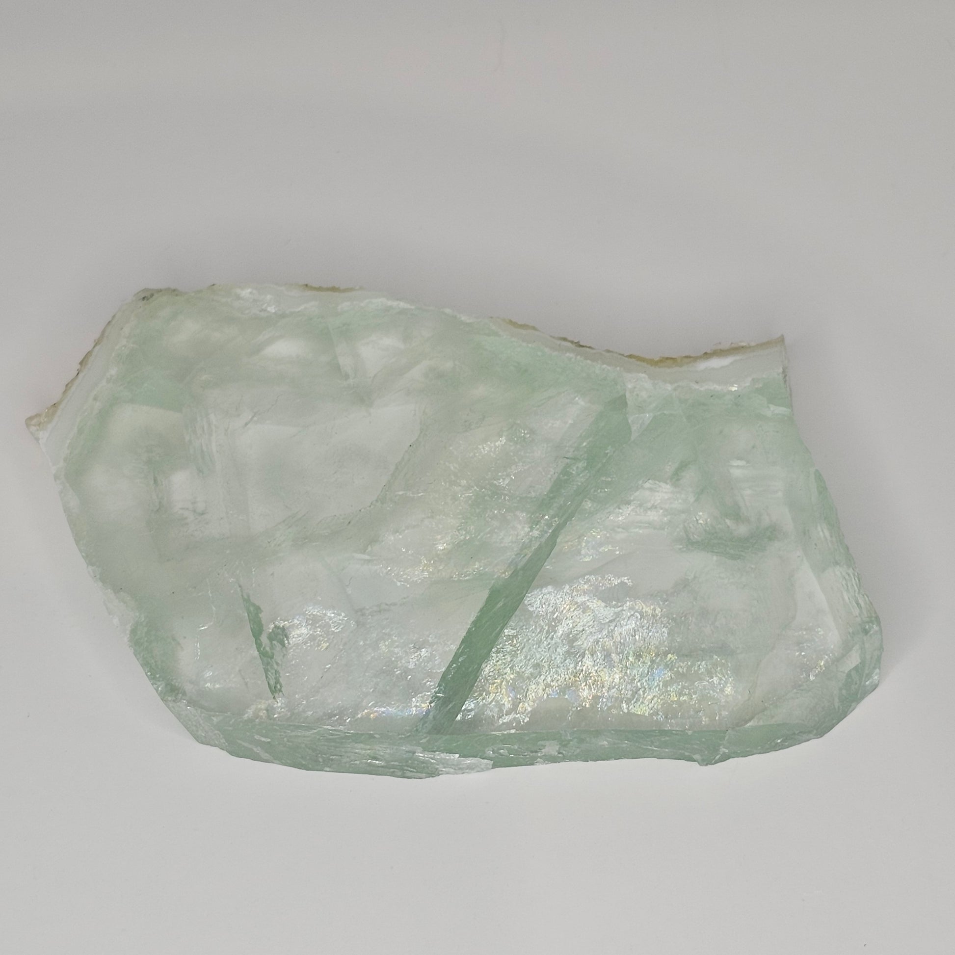 Stunning transparent Green Fluorite slab overflowing with gorgeous rainbows within.
