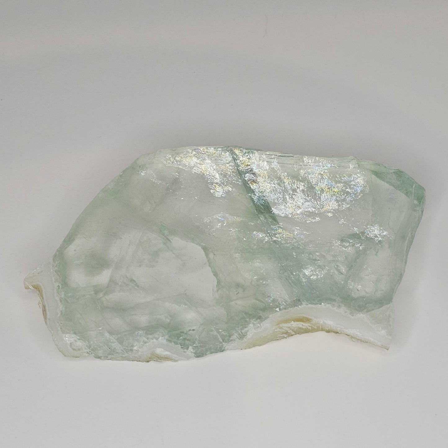 Stunning transparent Green Fluorite slab overflowing with gorgeous rainbows within.
