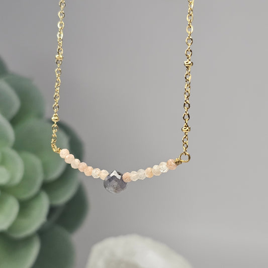 Gold toned stainless steel chain adorned with dainty Lapis Lazuli and Sunstone beads.
