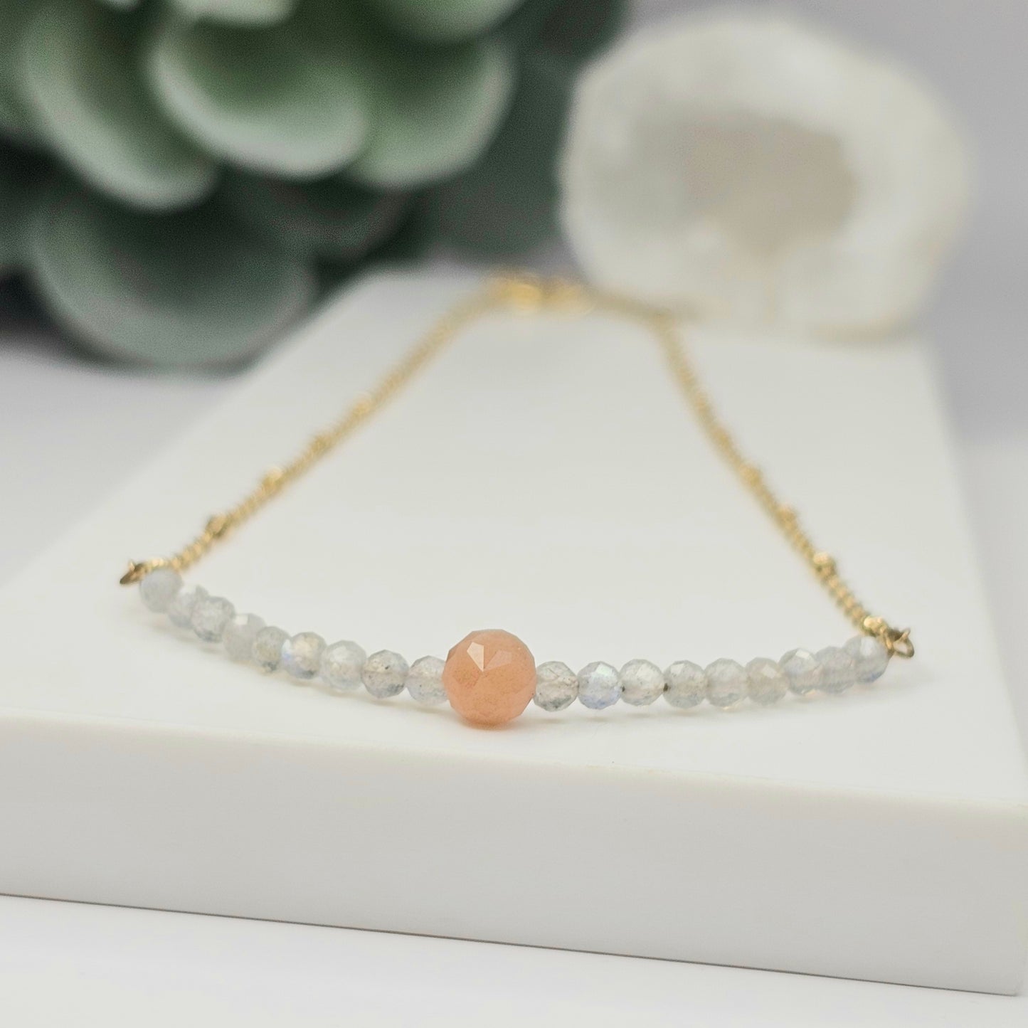 Gold toned stainless steel chain adorned with dainty Sunstone and Labradorite beads.