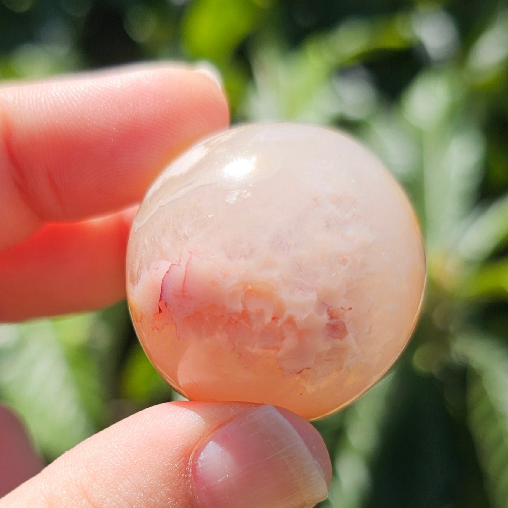 Small Flower Agate sphere with two visible angel number 8's.