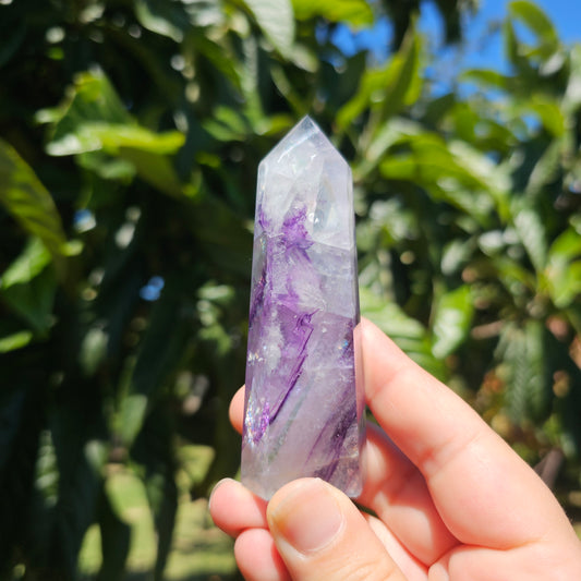 Spectacular clear Fluorite tower with vibrant purple, pastel blue &amp; pastel green banding. Also has beautiful rainbows throughout.