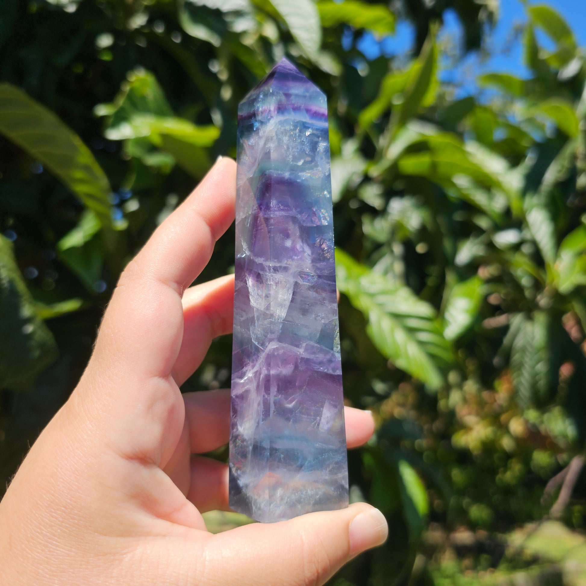 Large Fluorite tower with vibrant blue, purple and green banding, and gorgeous rainbows throughout.