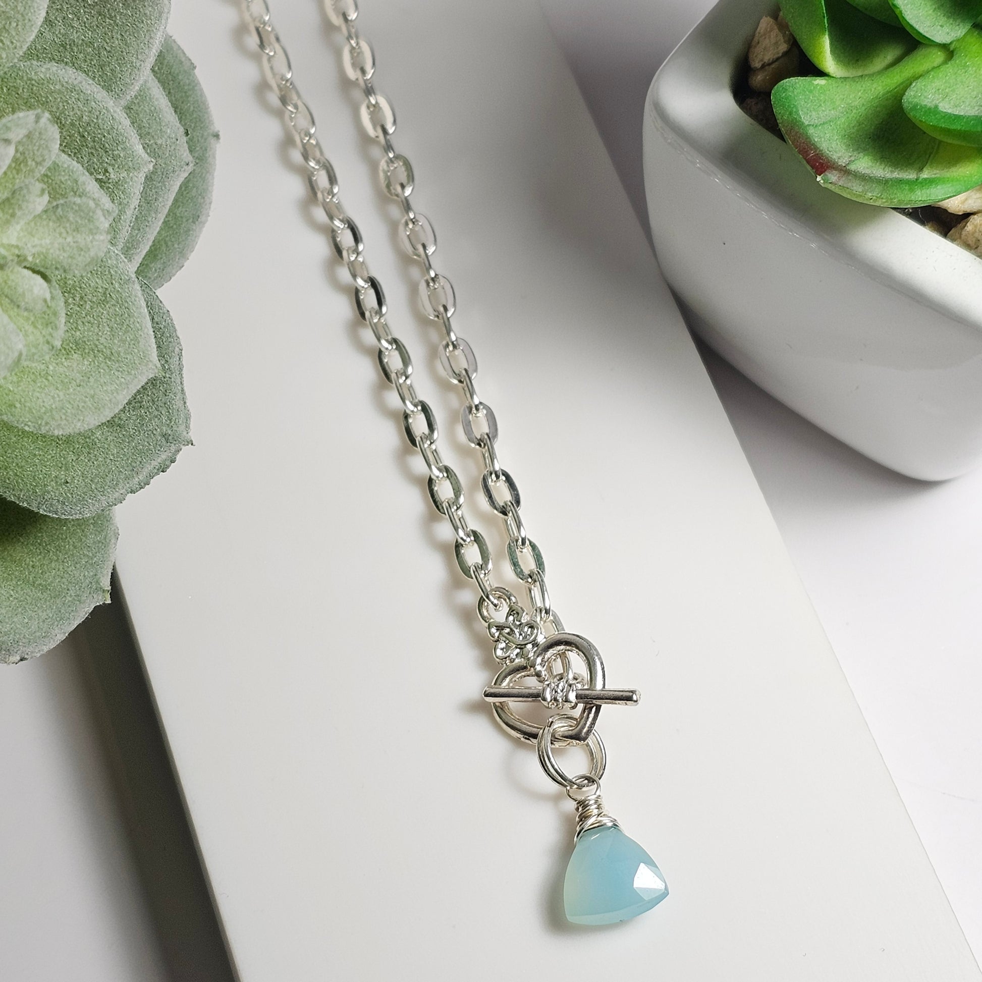'Clasp the heart' necklace | A wire wrapped stunning Blue Chalcedony bead suspended from a silver toned heart clasp and fastened to a iron paperclip chain. Necklace length: 45cm focal drop length: 2cm