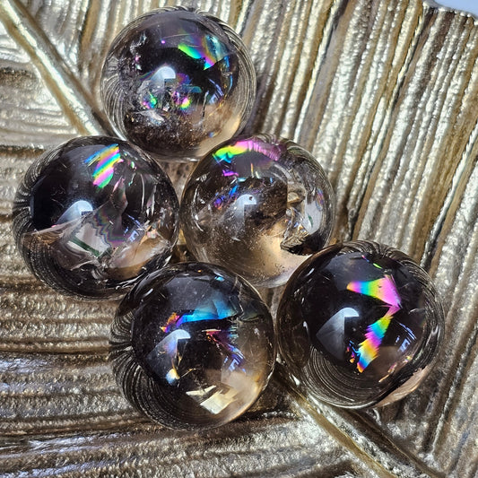 Small high quality Smoky Quartz spheres, all with spectacular rainbows. Origin: Brazil