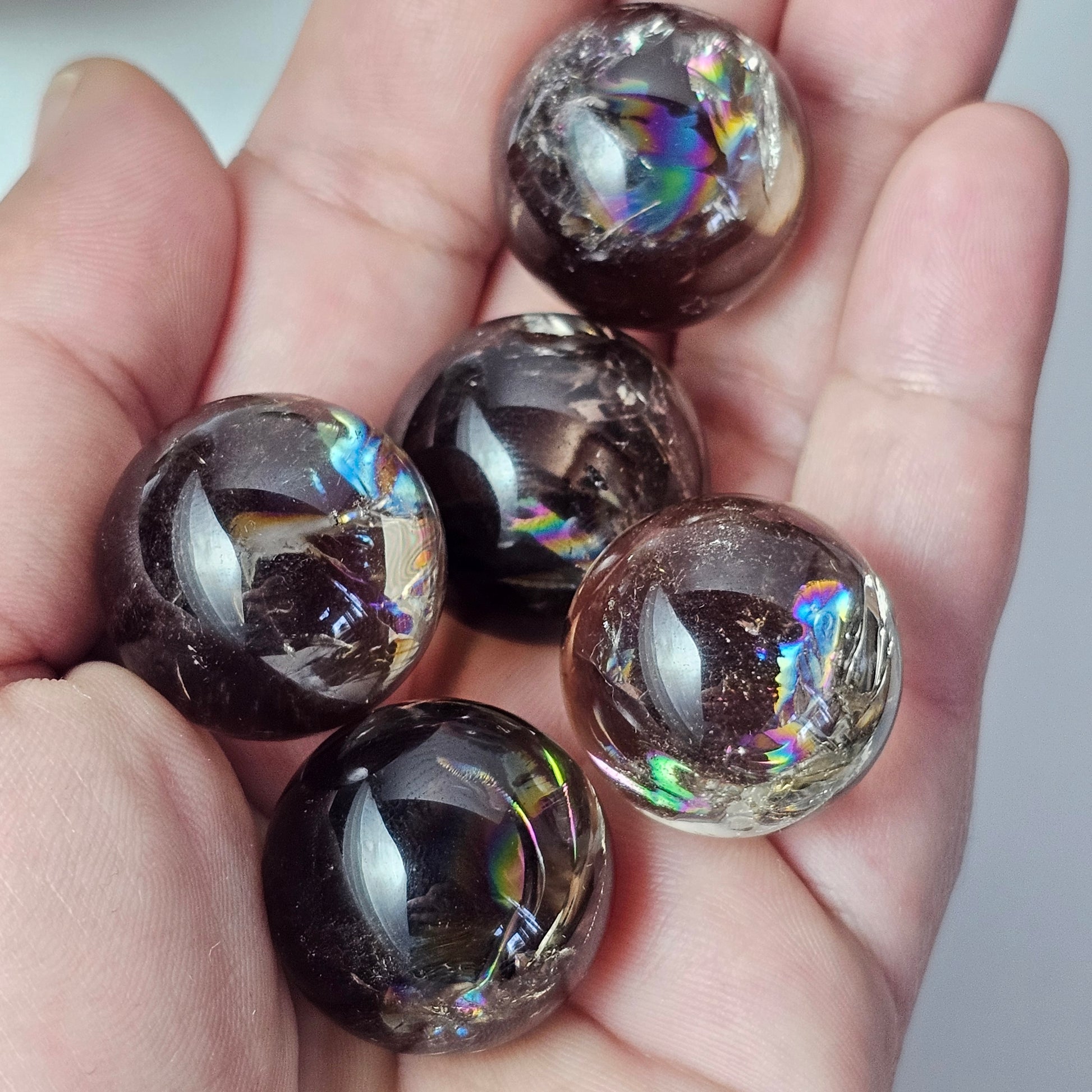 Small high quality Smoky Quartz spheres, all with spectacular rainbows. Origin: Brazil