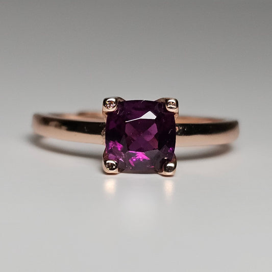 Adjustable rose gold plated sterling silver ring features a stunning solitaire Purple Garnet stone.