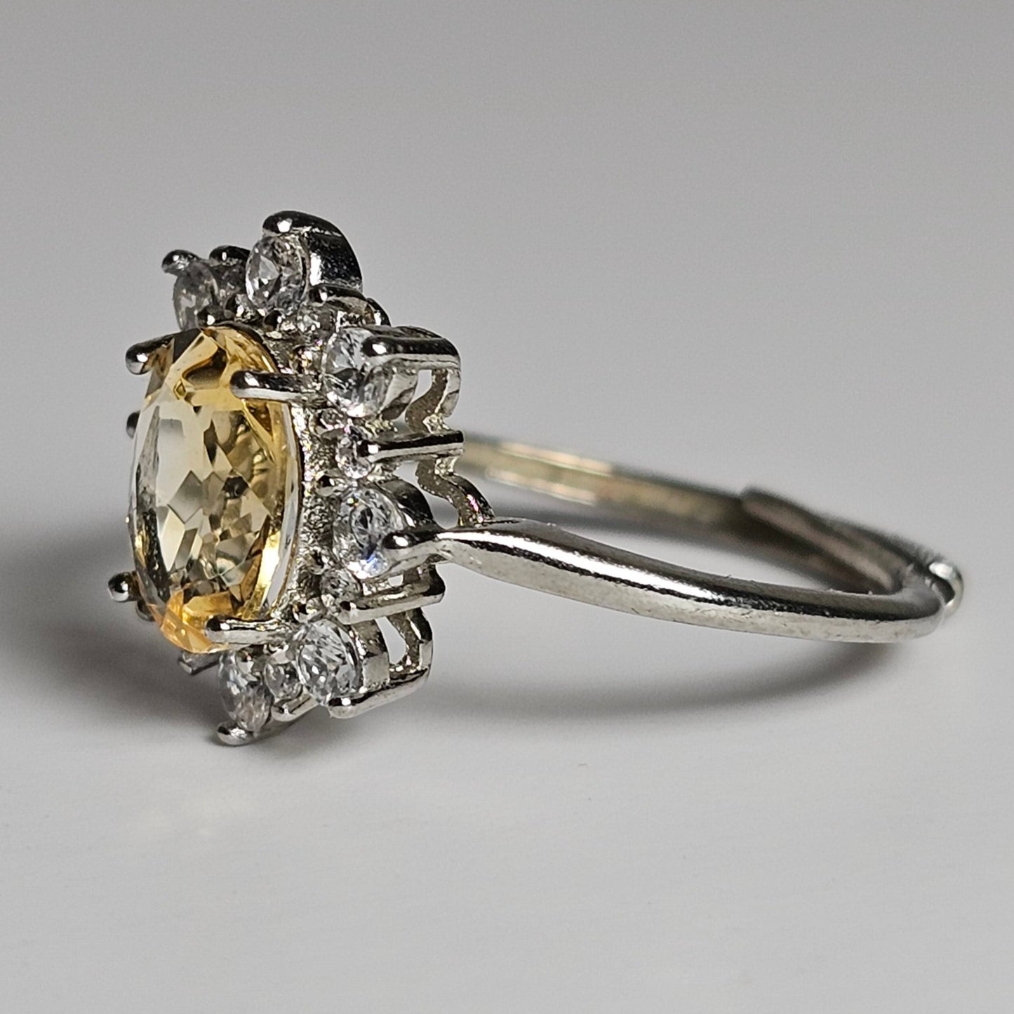 This floral burst ring is crafted from sterling silver and features a stunning oval shaped Citrine centre stone surrounded with zircon.
