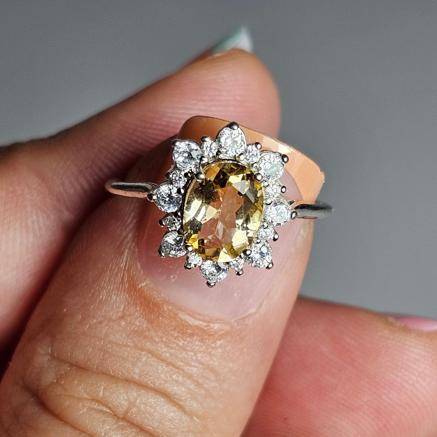 This floral burst ring is crafted from sterling silver and features a stunning oval shaped Citrine centre stone surrounded with zircon.