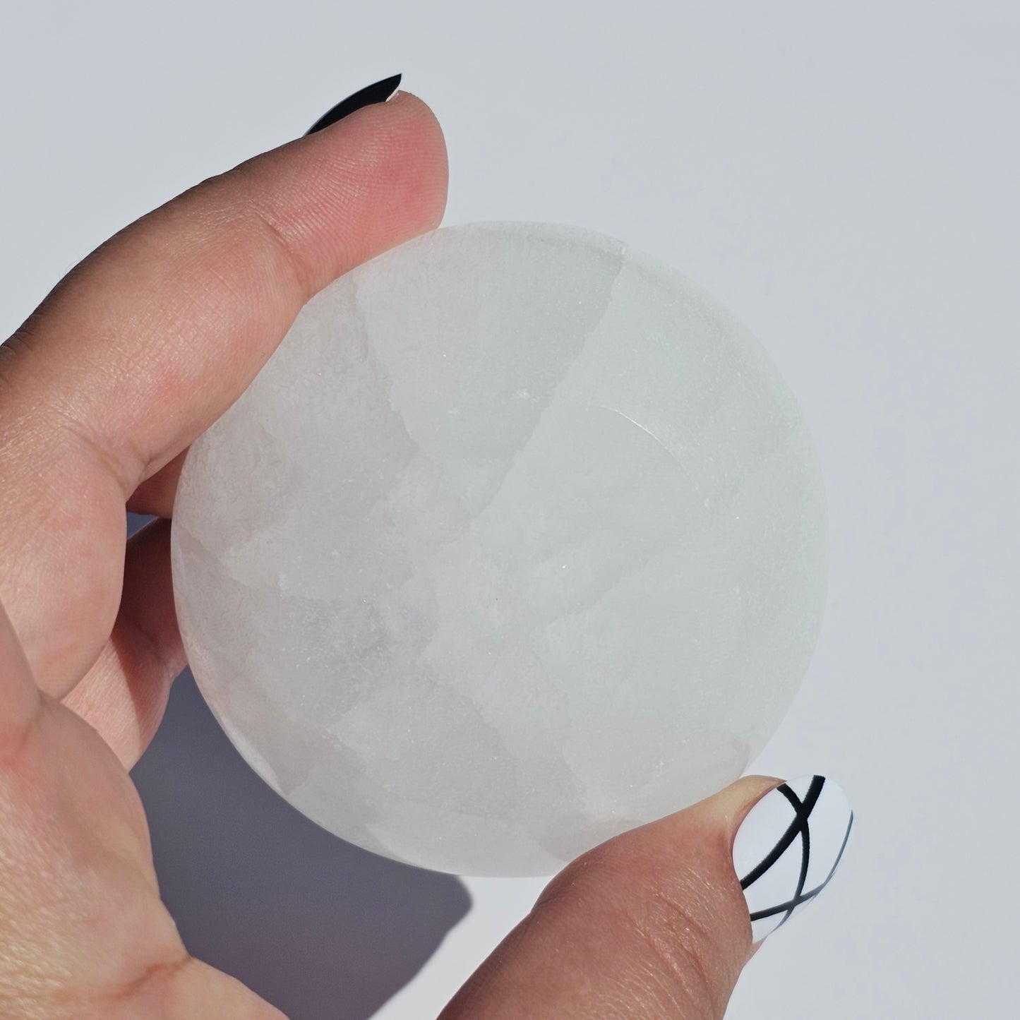 A small Selenite round dish perfect for cleansing your mini crystals.