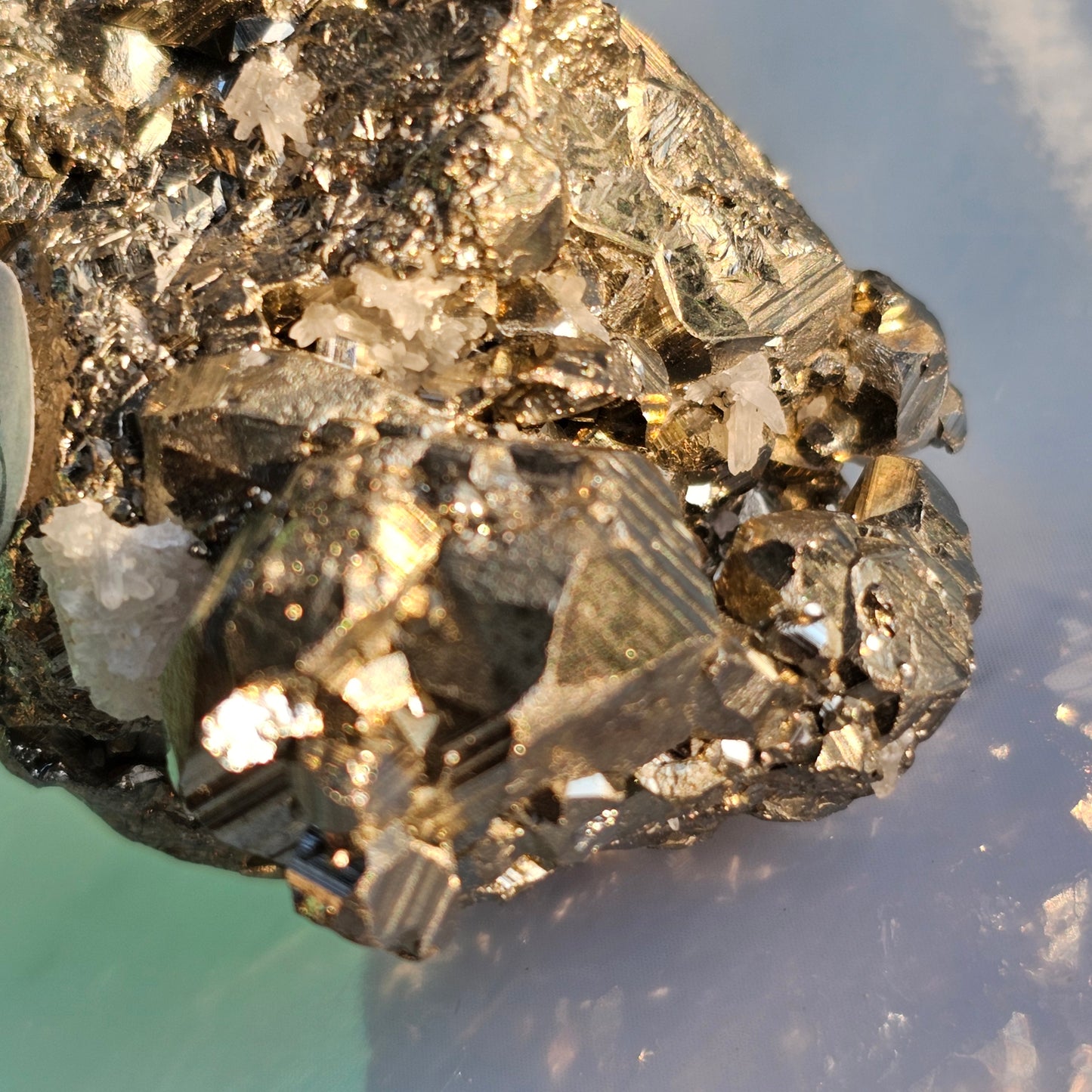 Natural Pyrite cluster in its raw form. This mineral displays a brilliant metallic lustre, with well-defined and sharp parallel striations.