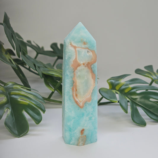 Blue Aragonite tower showing soft blue and green tones with smooth polished finish and natural variation.