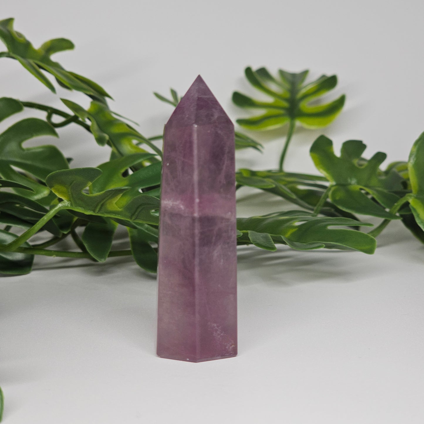 Fluorite crystal tower side view displaying veining and translucent natural formation