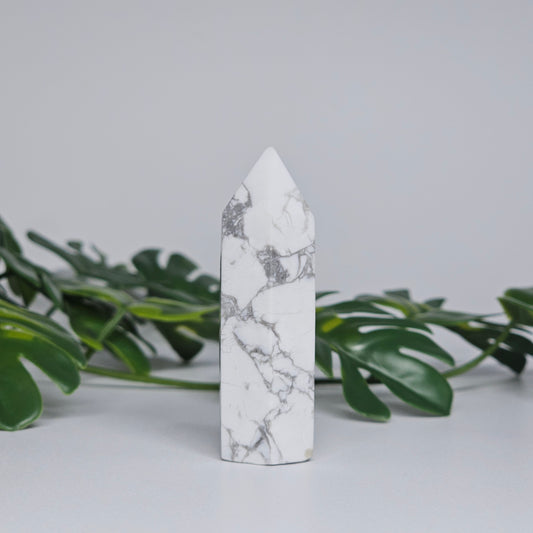 Side view of Howlite tower showing natural marble-like pattern.