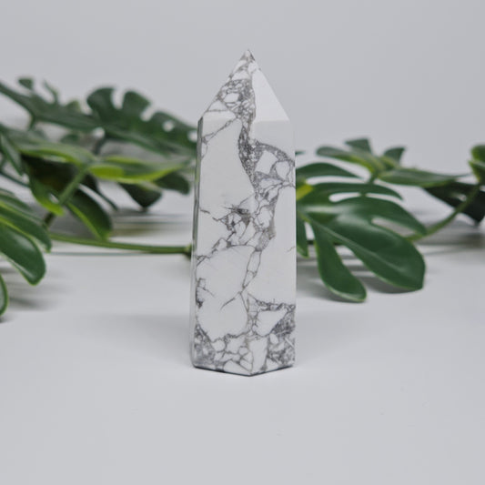 Side view of Howlite tower showing natural marble-like pattern.