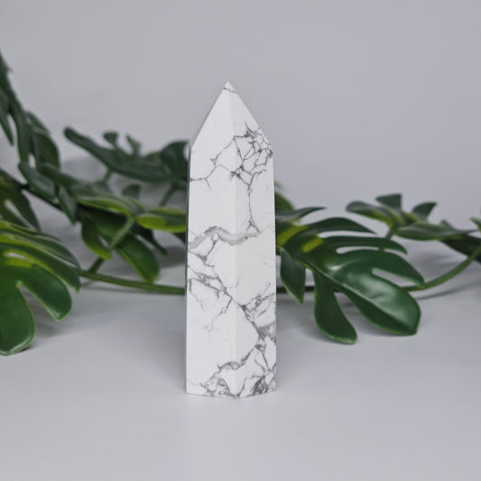 Side view of Howlite tower showing natural marble-like pattern.