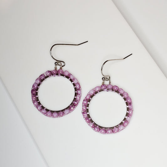 Marbled Lilac Japanese seed beads handwoven onto silver toned stainless steel hoops, suspended from silver toned stainless steel ear wires.
