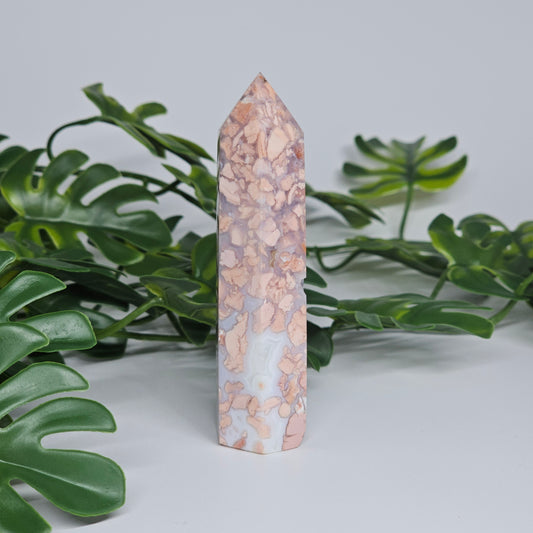Cotton candy agate tower crystal showing layered pastel colours and polished point