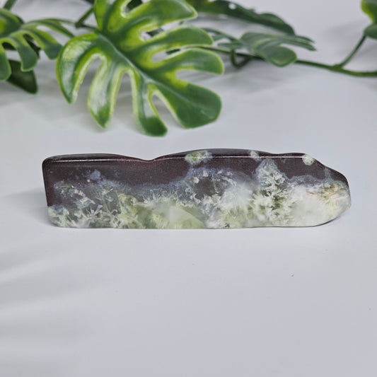 Polished Prehnite slab featuring soft green colouring, natural inclusions, and a smooth finish. Beautiful crystal display piece available in Australia.
