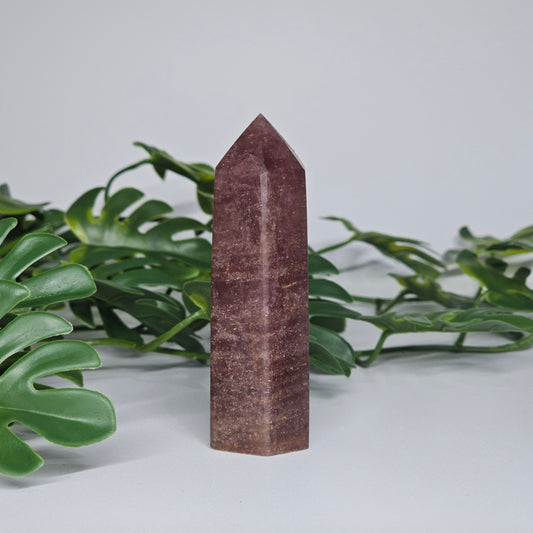 Strawberry quartz crystal tower with deep pink red tones and natural shimmering inclusions