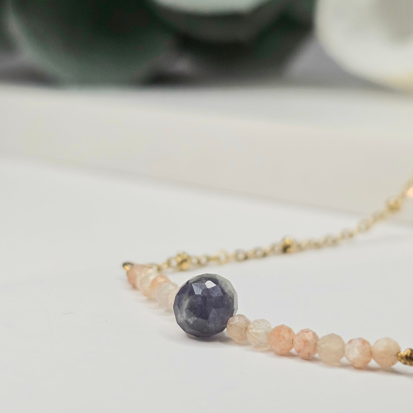 Gold toned stainless steel chain adorned with dainty Lapis Lazuli and Sunstone beads.