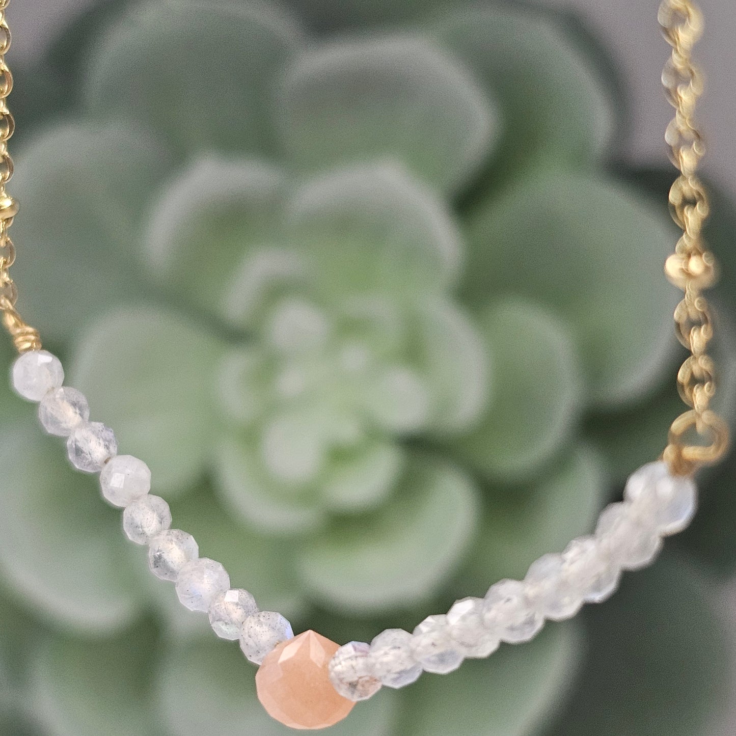 Gold toned stainless steel chain adorned with dainty Sunstone and Labradorite beads.