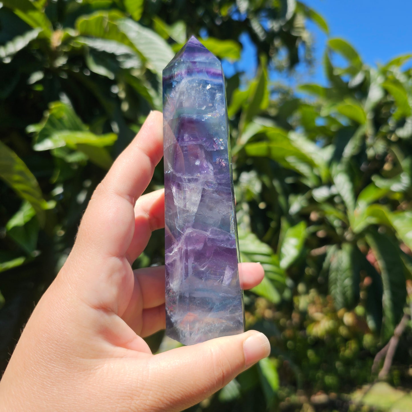 Large Fluorite tower with vibrant blue, purple and green banding, and gorgeous rainbows throughout.