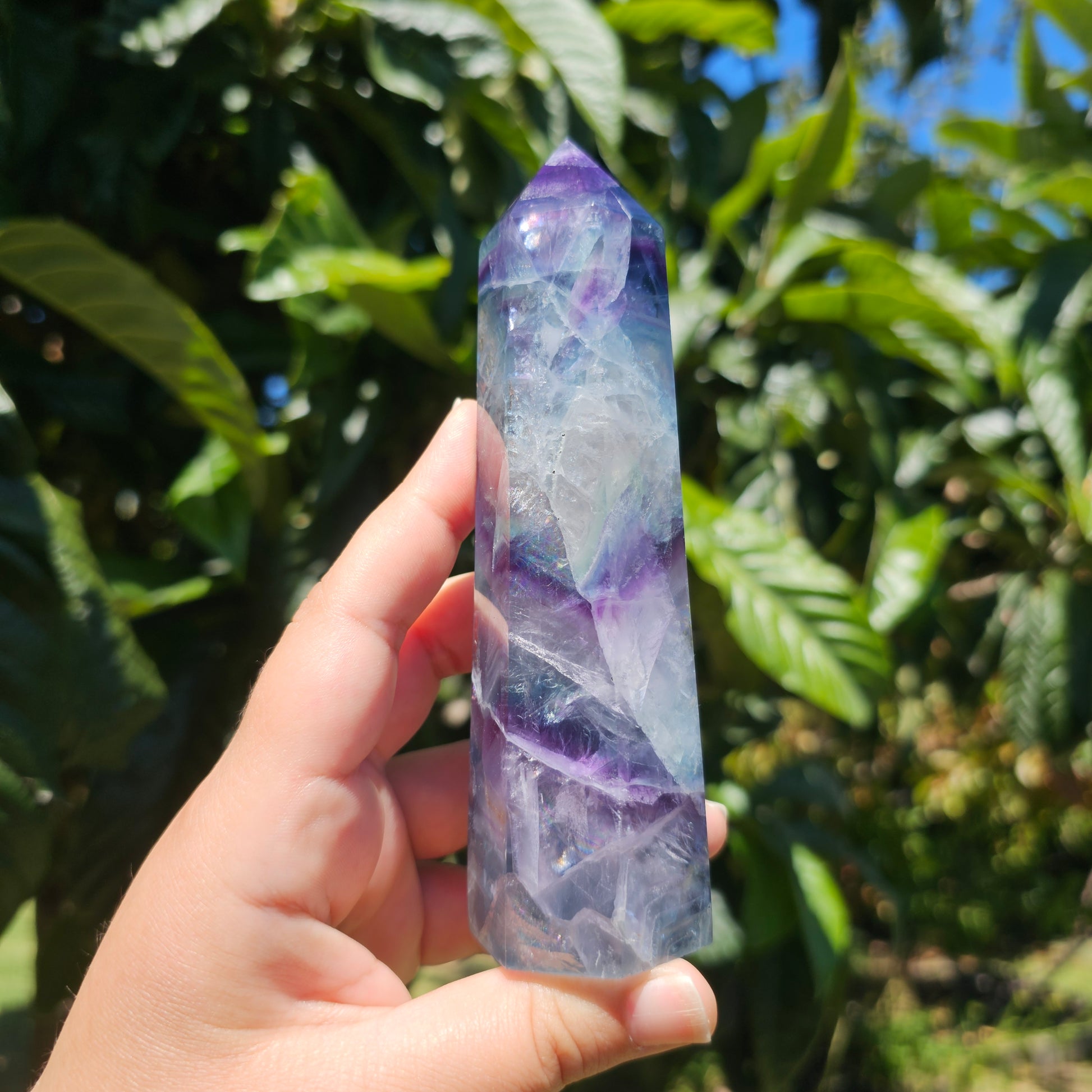 Large Fluorite tower with vibrant blue, purple and green banding, and gorgeous rainbows throughout.