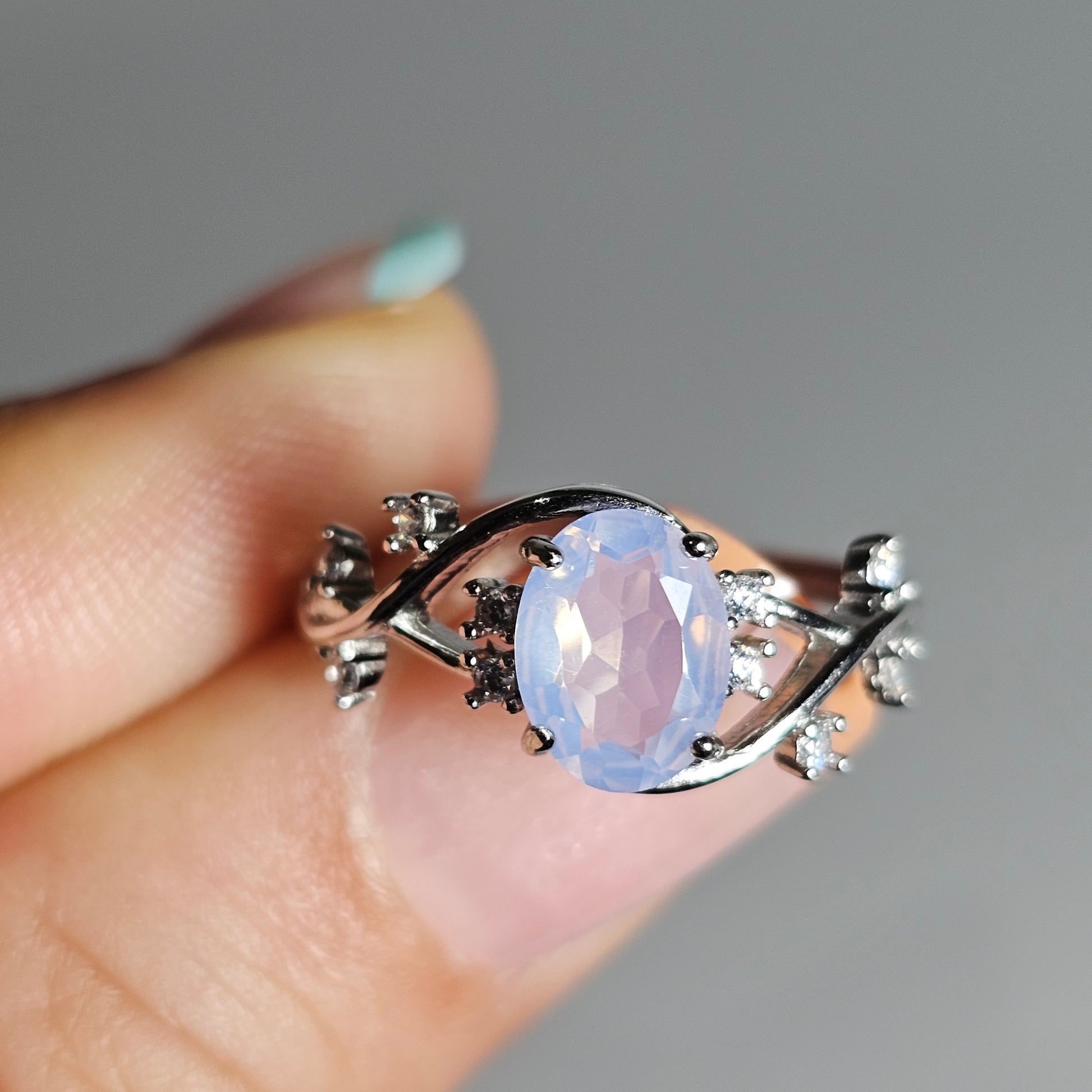 Adjustable oval cut Lavender Amethyst 925 sterling silver ring with Zircon on ornate vine shoulders.