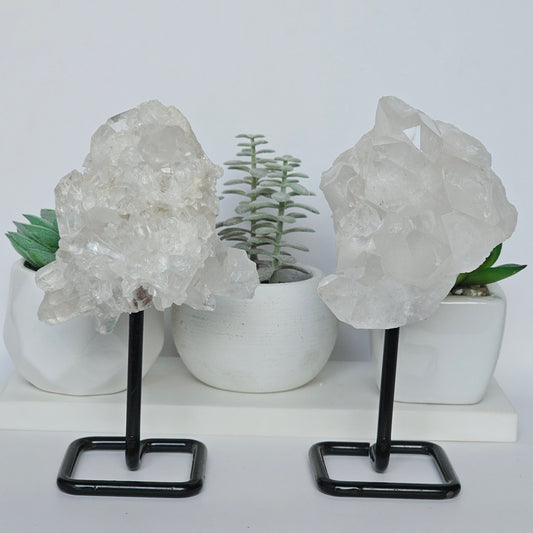 Clear Quartz clusters on black metal stands