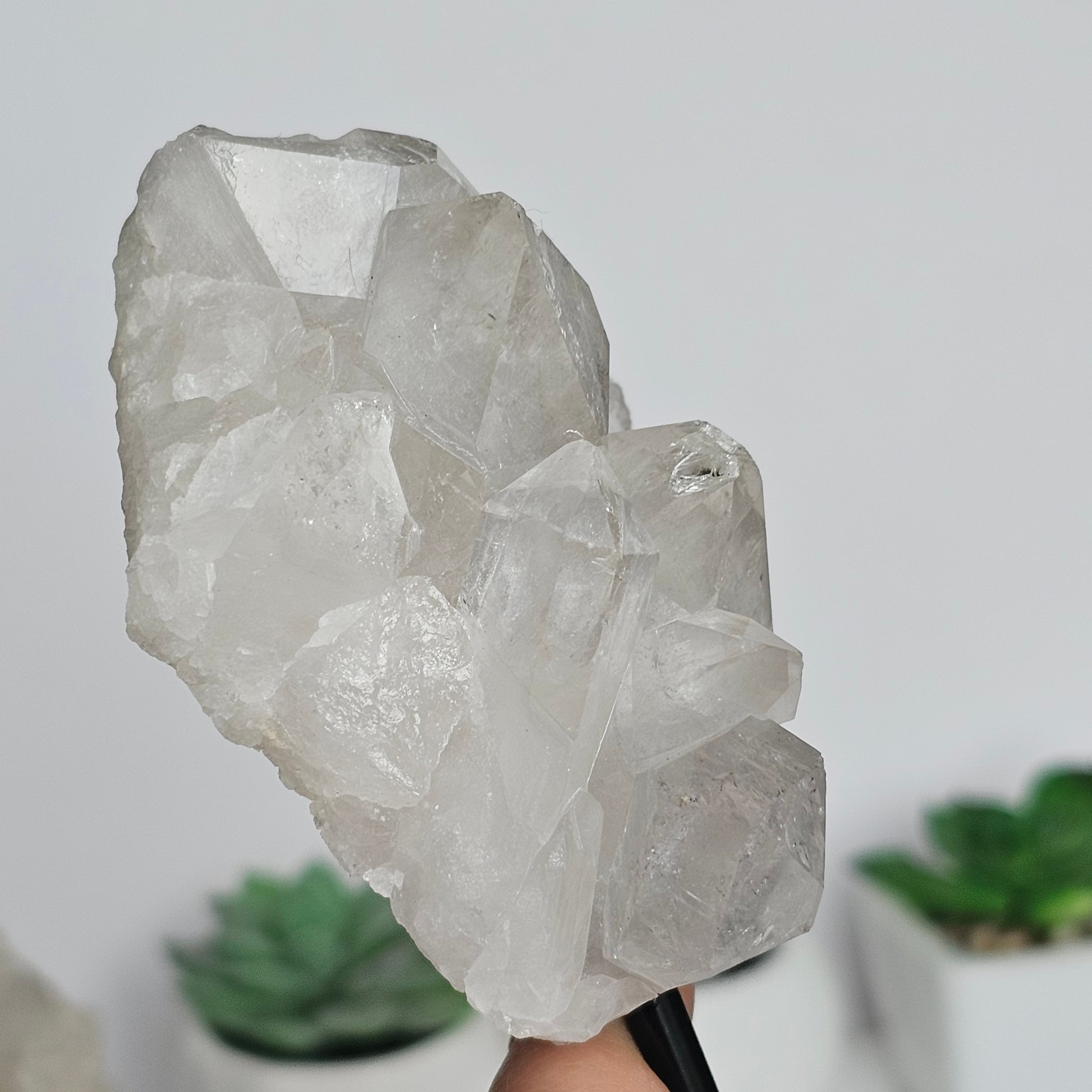 Clear Quartz clusters on black metal stands