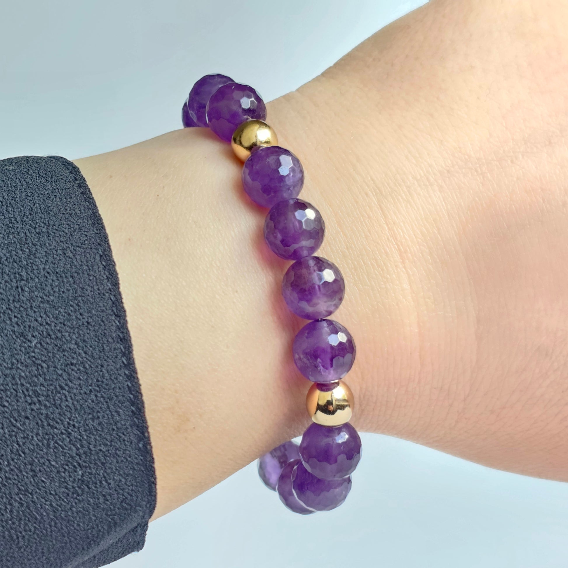 10mm Alluring faceted Amethyst and gold plated Hematite bead stretch bracelet.