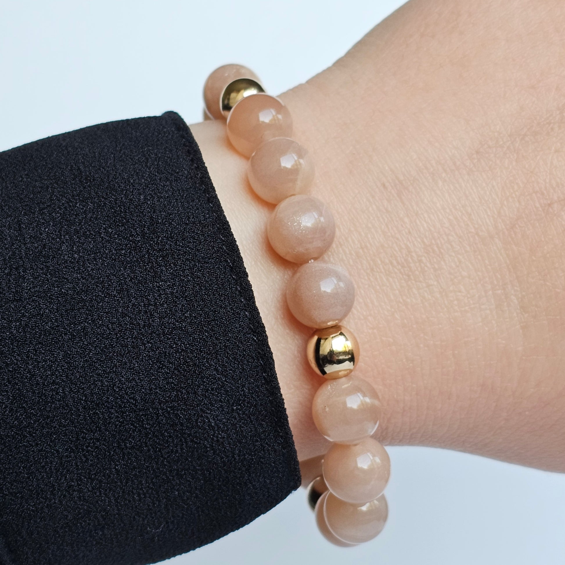 10mm Shimmering A+ grade Sunstone and gold plated Hematite bead stretch bracelet.