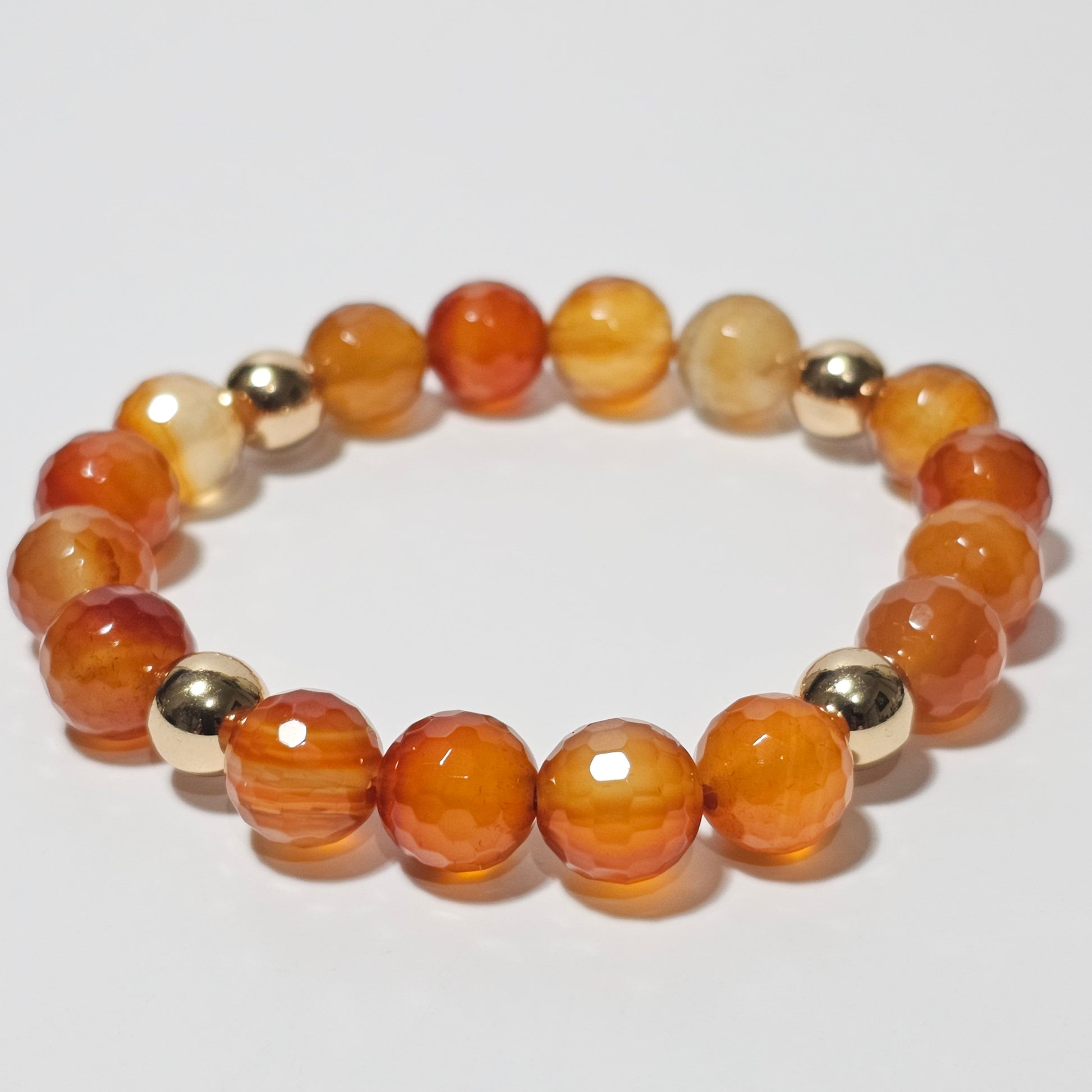 10mm Faceted gorgeous Carnelian and gold plated Hematite bead stretch bracelet.