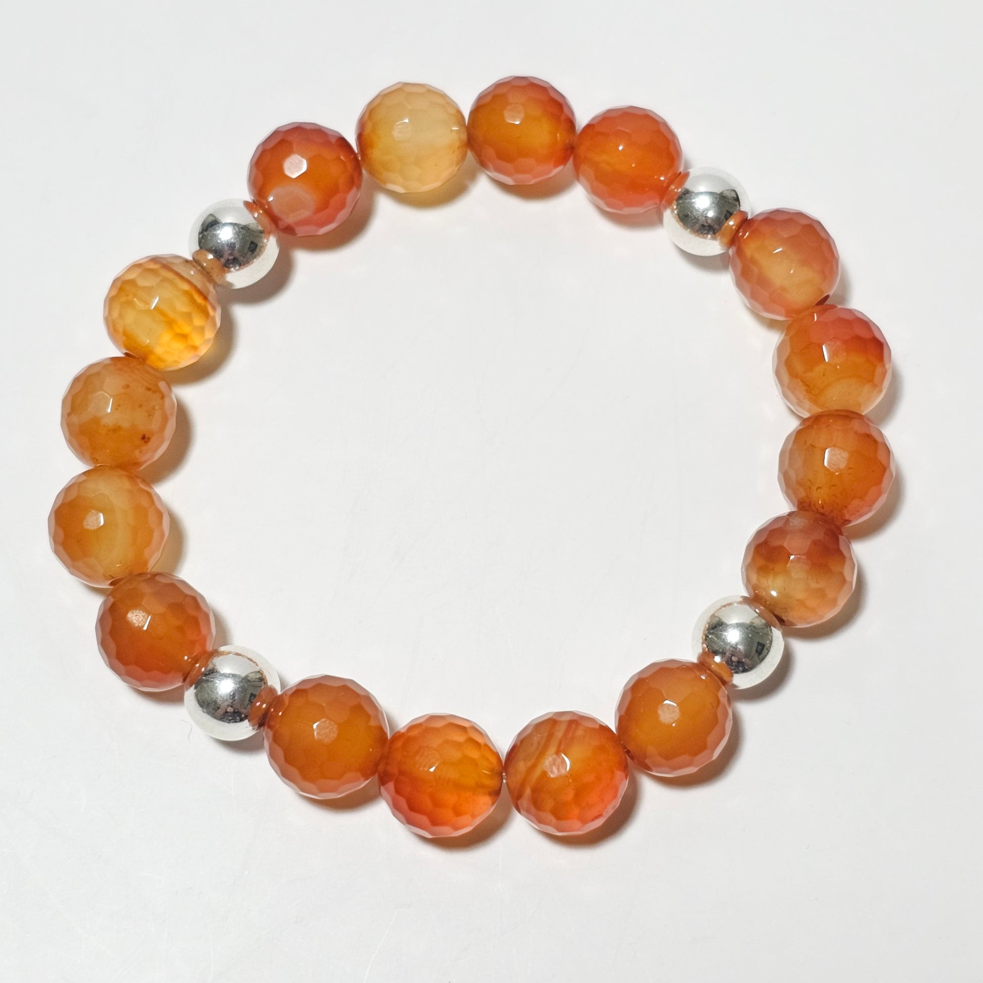 10mm Faceted gorgeous Carnelian and silver plated Hematite bead stretch bracelet.