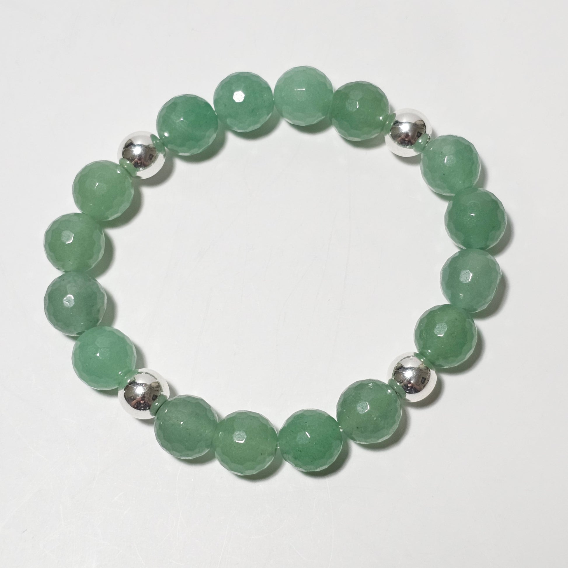 10mm Faceted stunning Green Aventurine and silver plated Hematite bead stretch bracelet.