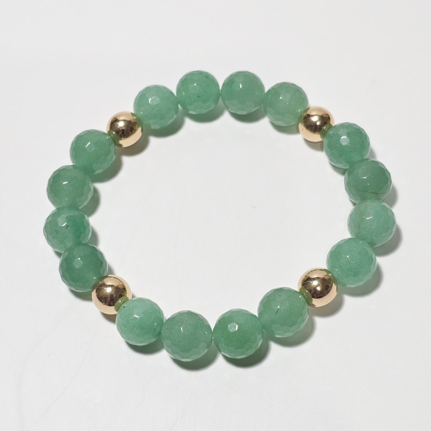 10mm Faceted stunning Green Aventurine and gold plated Hematite bead stretch bracelet.