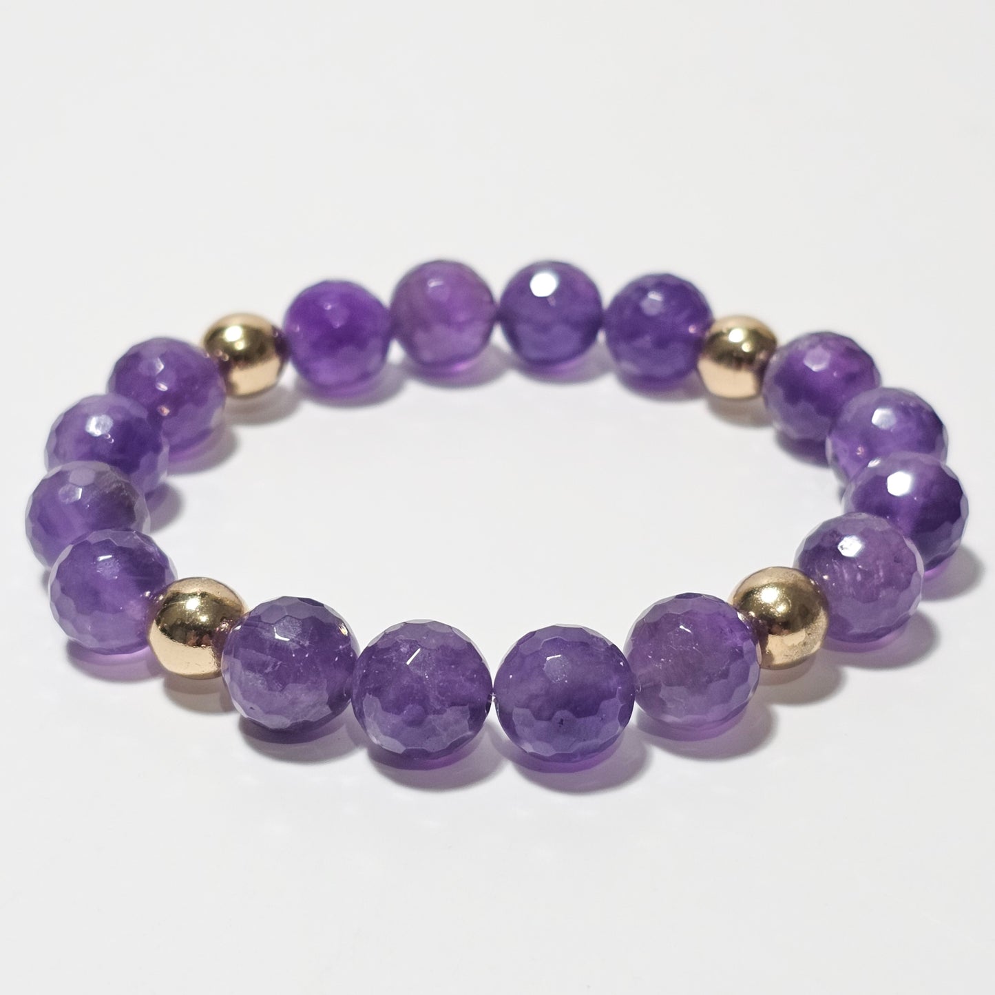 10mm Alluring faceted Amethyst and gold plated Hematite bead stretch bracelet.