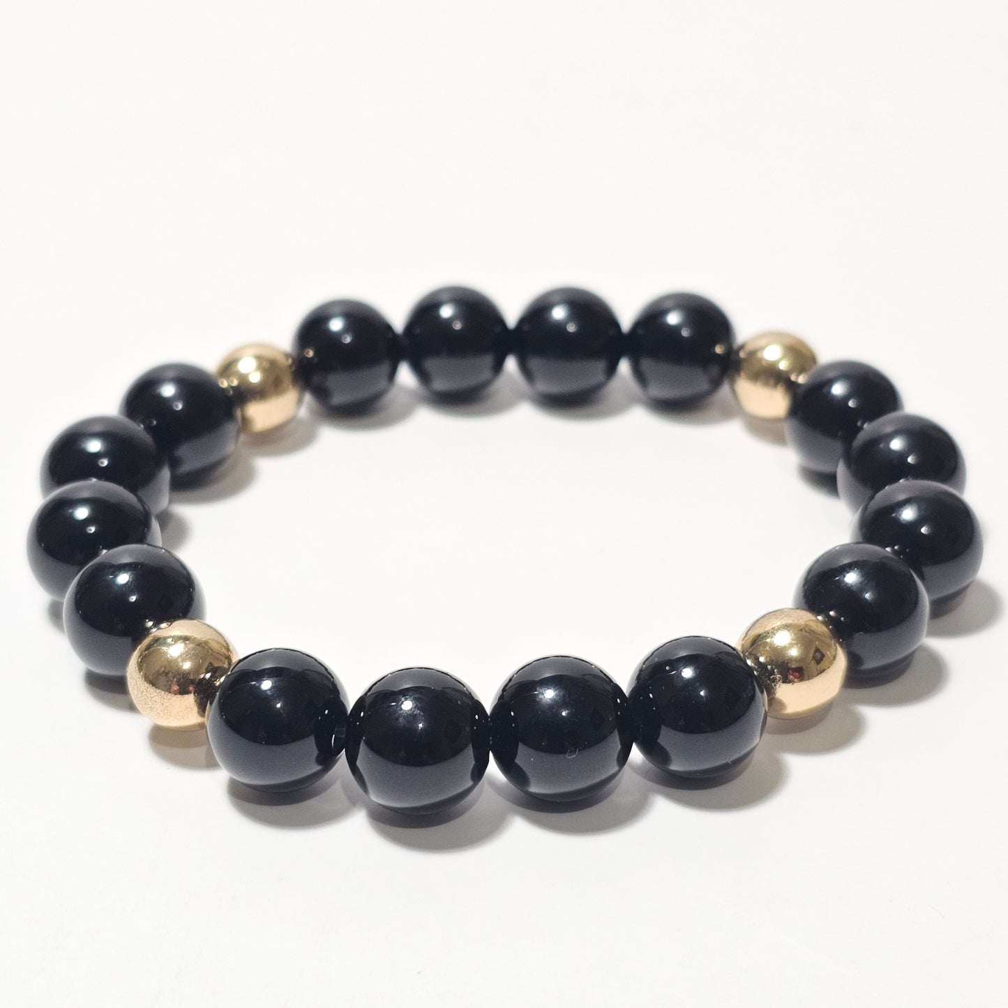 10mm Elegant Onyx and gold plated Hematite bead stretch bracelet.