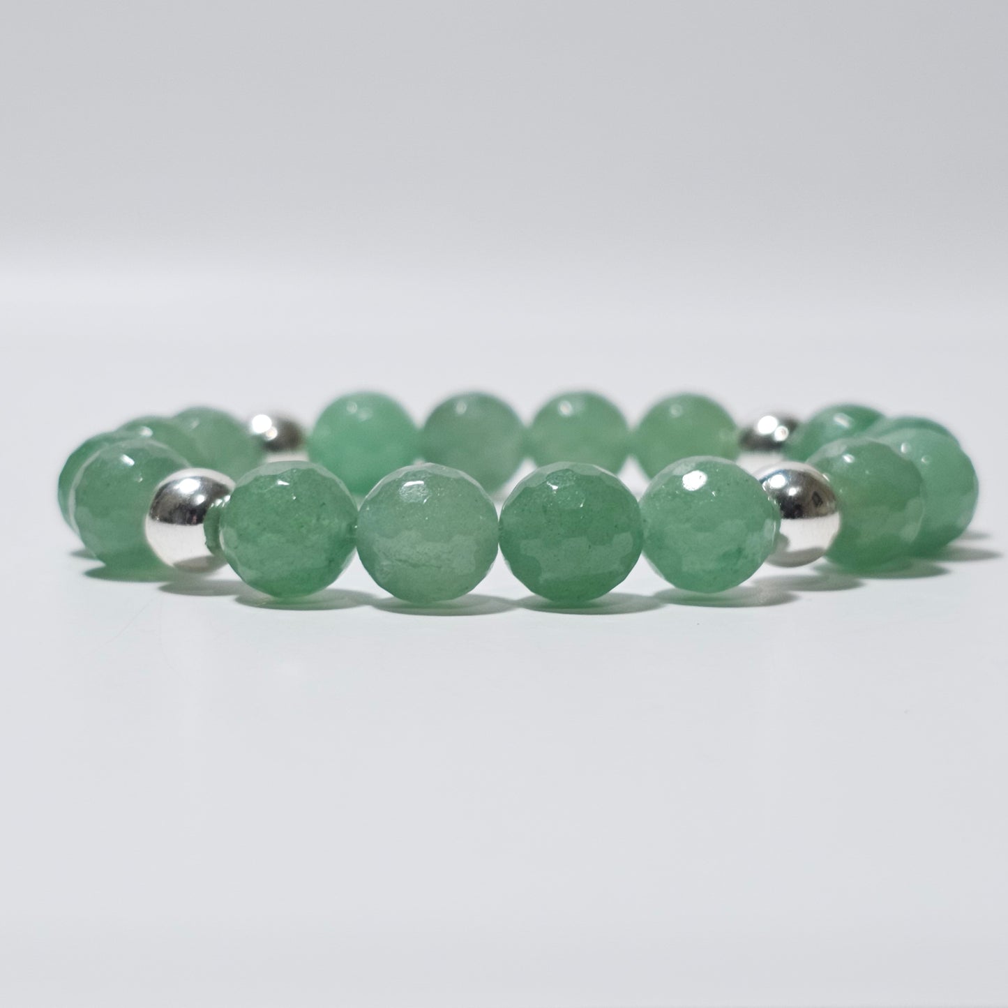 10mm Faceted stunning Green Aventurine and silver plated Hematite bead stretch bracelet.