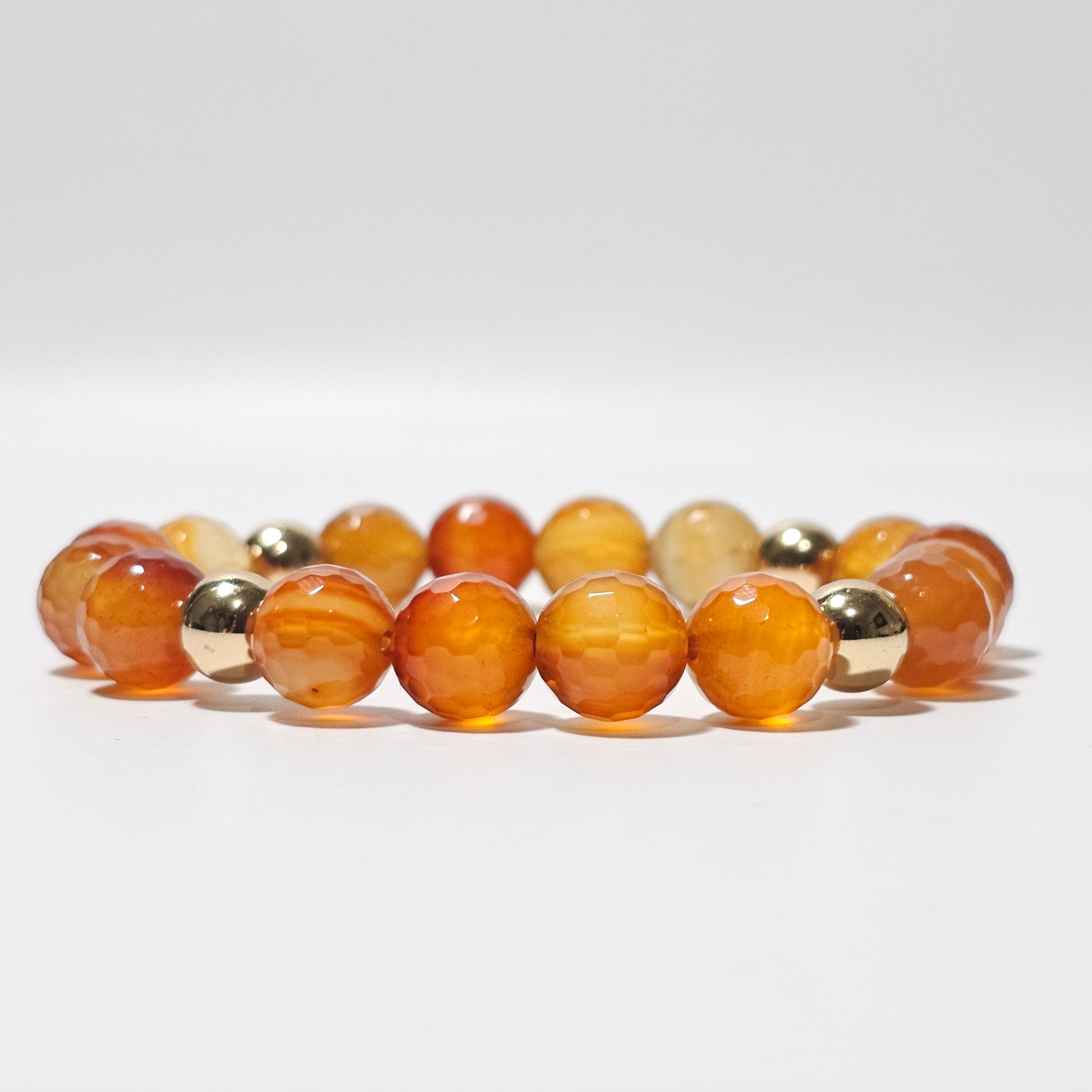 10mm Faceted gorgeous Carnelian and gold plated Hematite bead stretch bracelet.