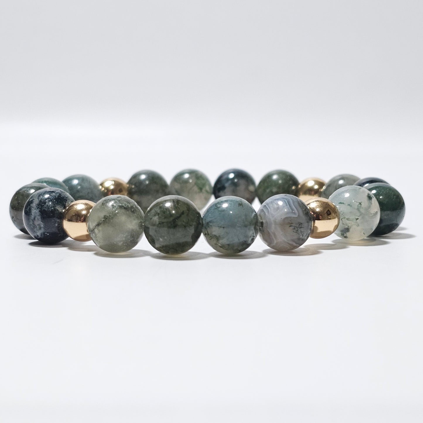 10mm Mesmerising Moss Agate and gold plated Hematite bead stretch bracelet.