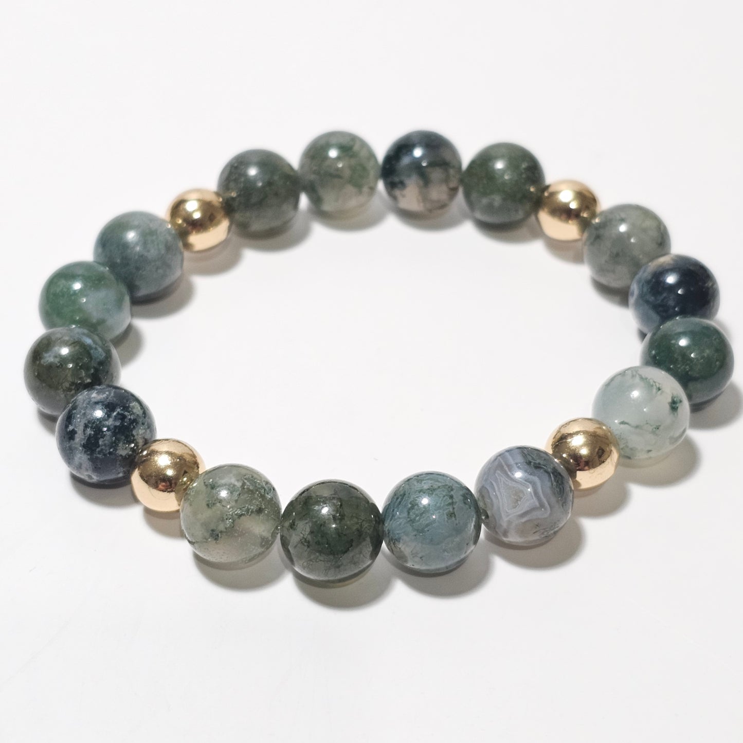 10mm Mesmerising Moss Agate and gold plated Hematite bead stretch bracelet.