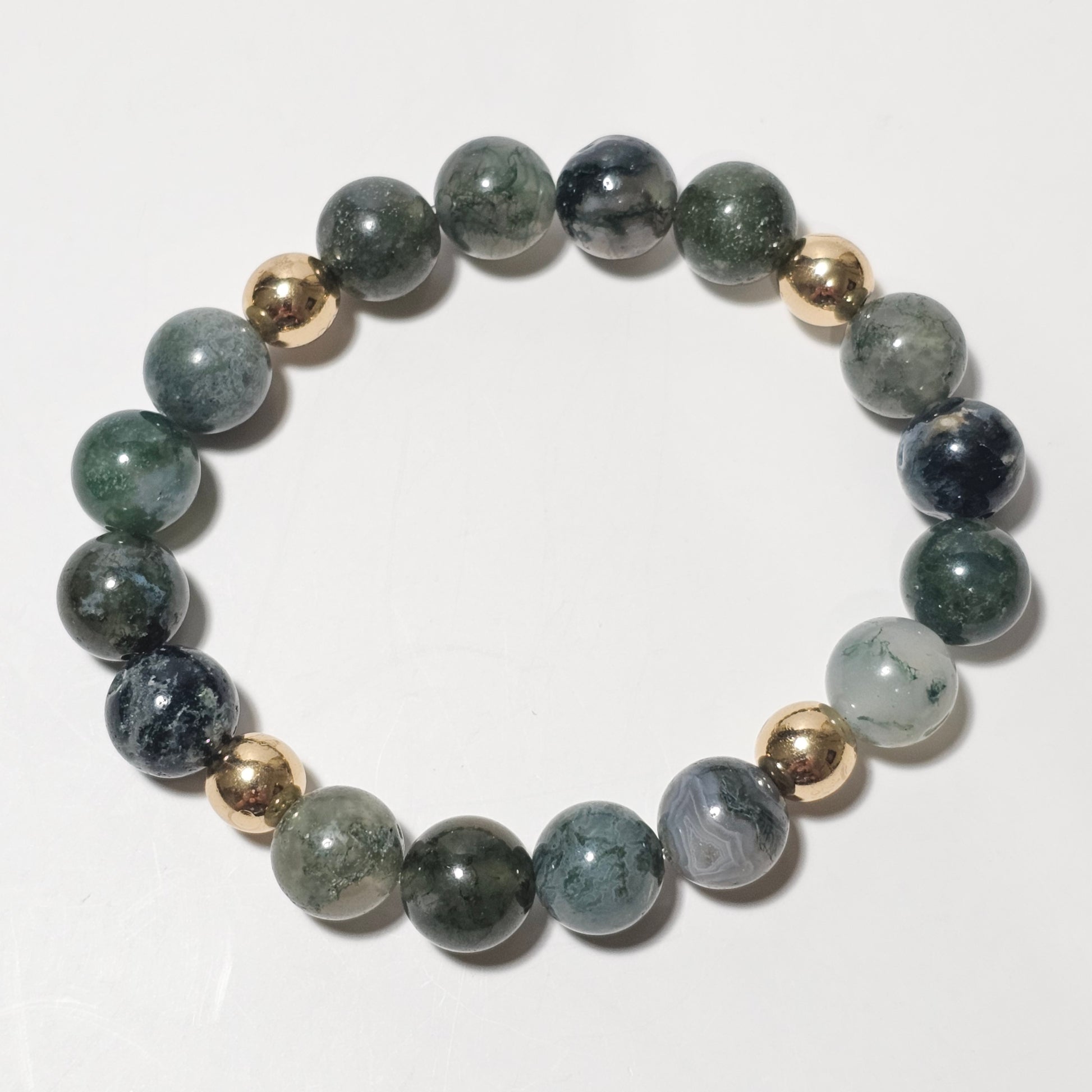 10mm Mesmerising Moss Agate and gold plated Hematite bead stretch bracelet.