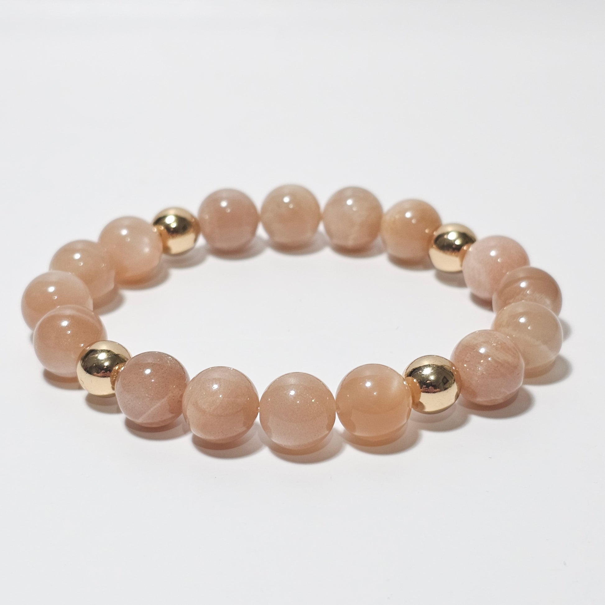 10mm Shimmering A+ grade Sunstone and gold plated Hematite bead stretch bracelet.