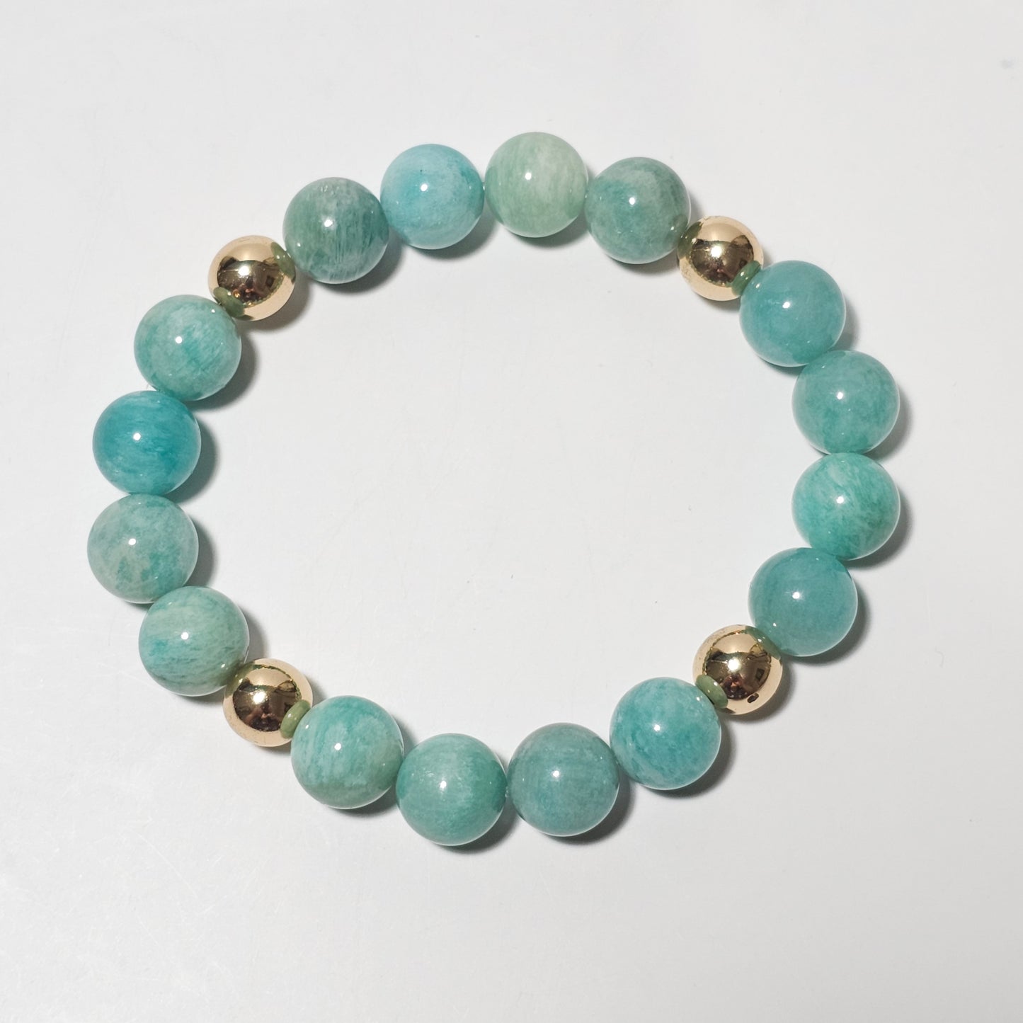 10mm Captivating Amazonite and gold plated Hematite bead stretch bracelet.