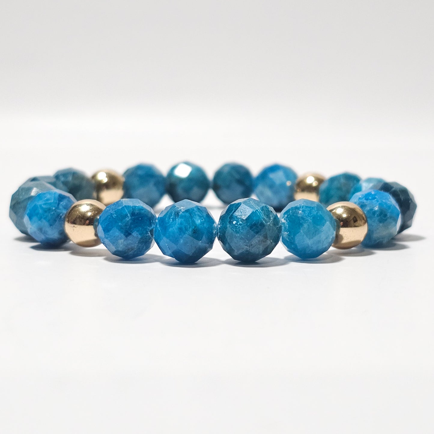 10mm Faceted Vibrant Blue Apatite and Gold Plated Hematite Bead Stretch Bracelet